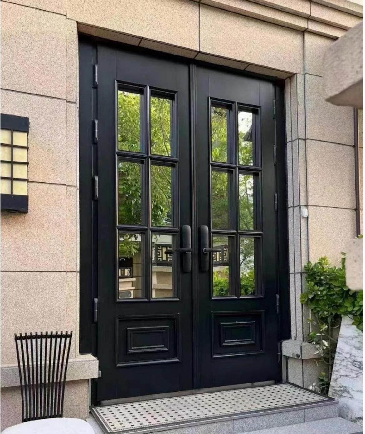 Black glazed entrance with lower panels